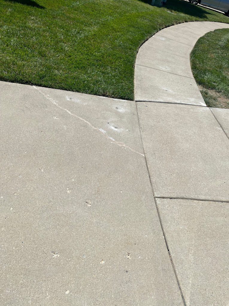 Concrete walkway and adjoining panel