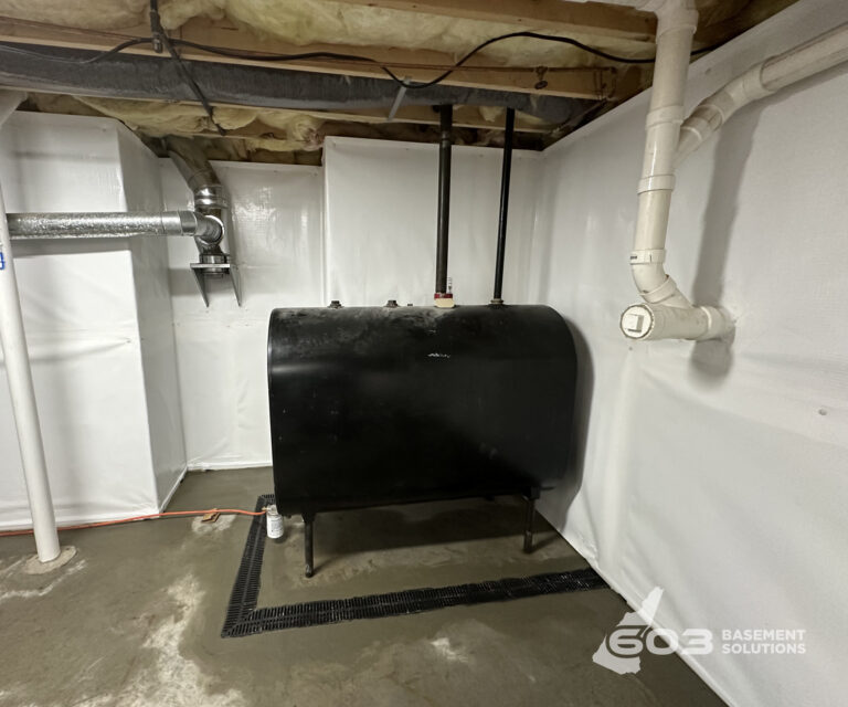 Interior basement drainage and wall vapor barrier installed by 603