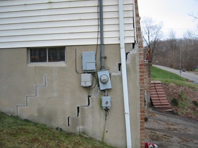 Stair-step foundation cracking and separation at the corner of a house