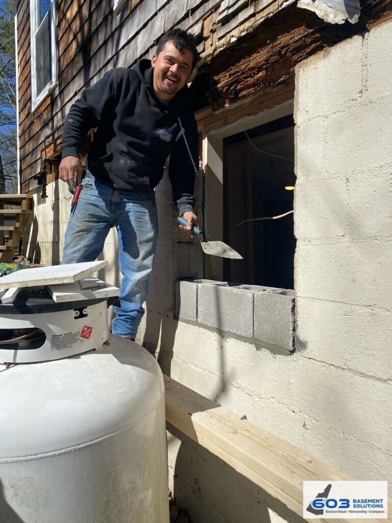 603 crew cutting out the rotted sill and setting the new opening on a New Hampshire home