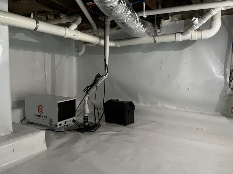 Sealed crawl space with wall liner, floor liner and dehumidifier