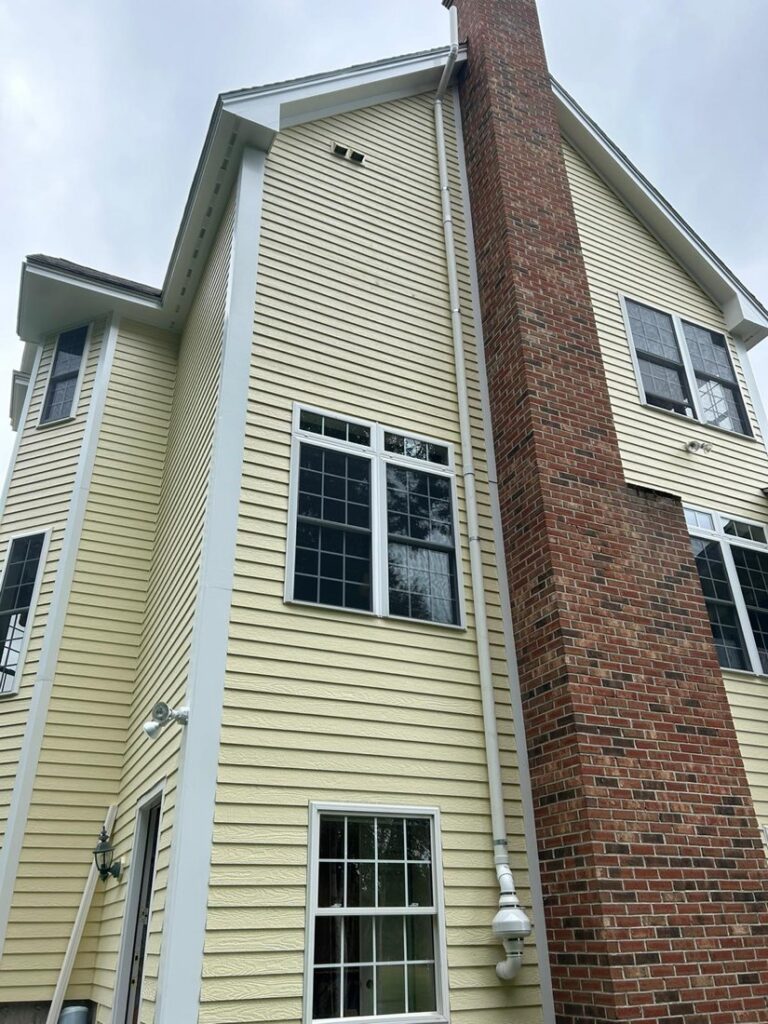 Exterior radon mitigation vent installed by 603 Basement Solutions