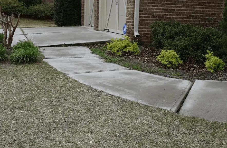 Aligned concrete walkway beside a home