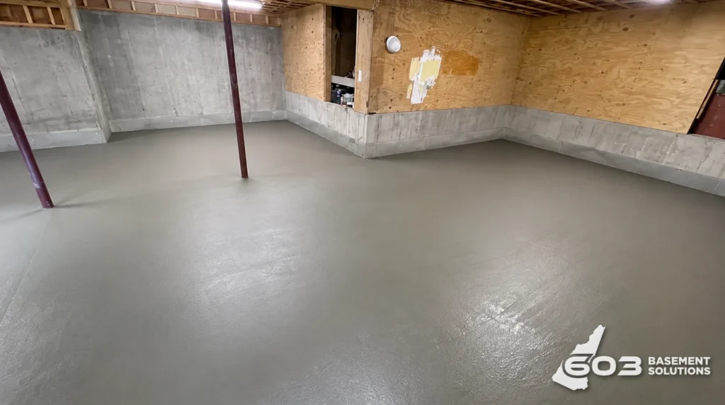 Freshly poured and finished concrete slab in a residential basement